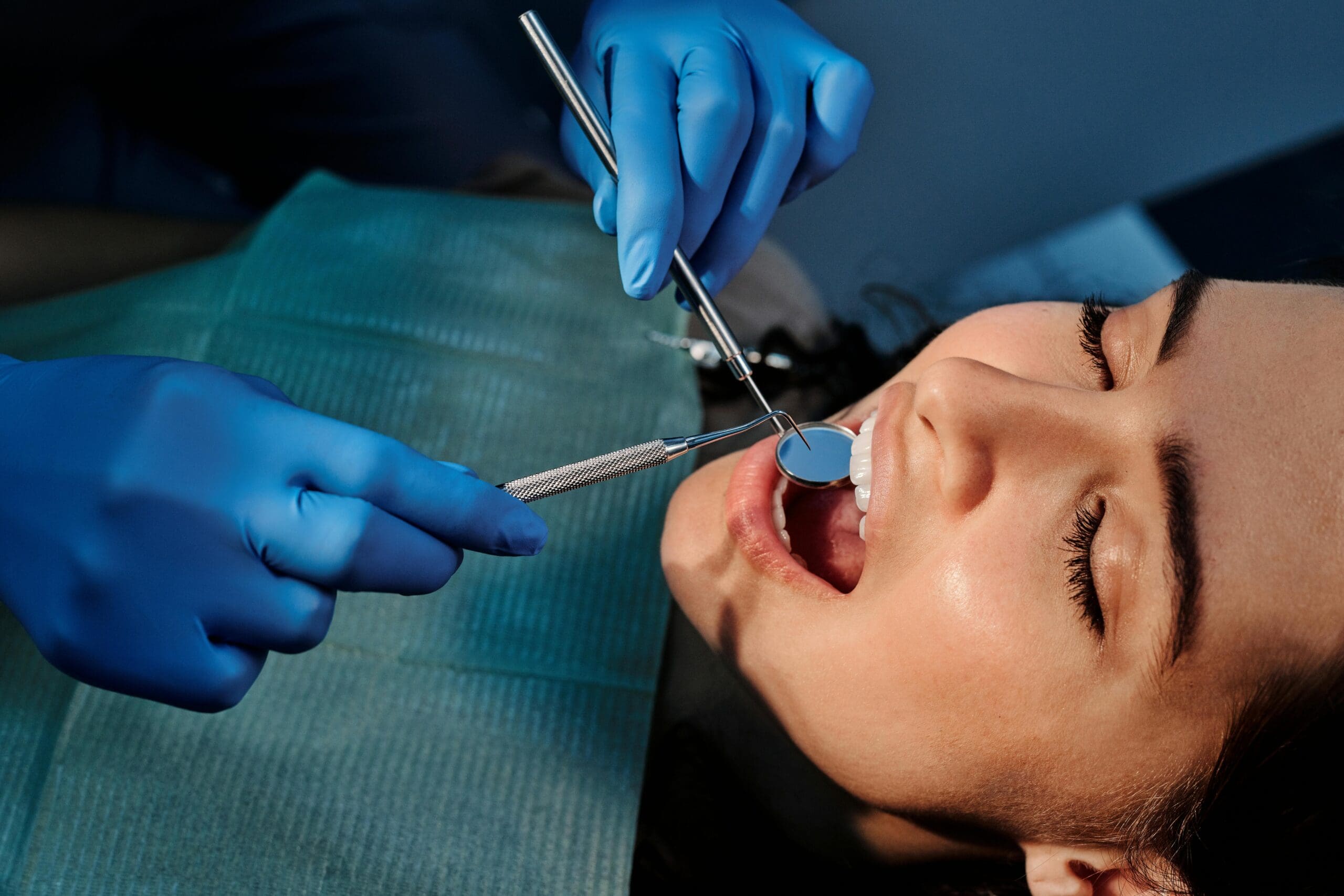 Woman undergoing a dental procedure at a clinic.